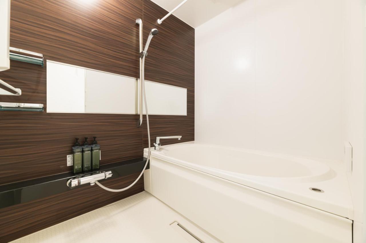 GRAND BASE Nagasaki Ekimae Aparthotel Bagian luar foto